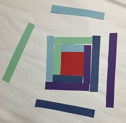 Strips of paper of different colors and sizes around a square.