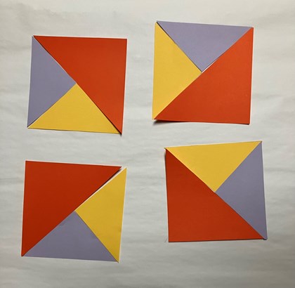Triangles of different colors laid out in four blocks.