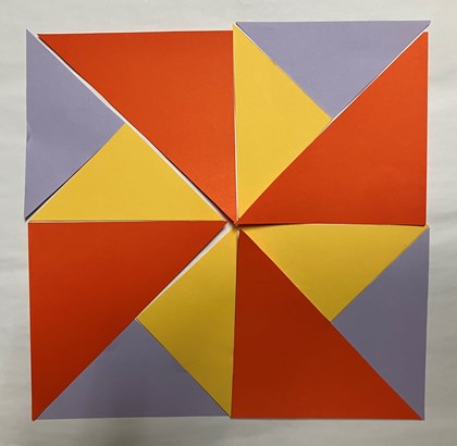 Triangles of different colors laid out in a complete block.