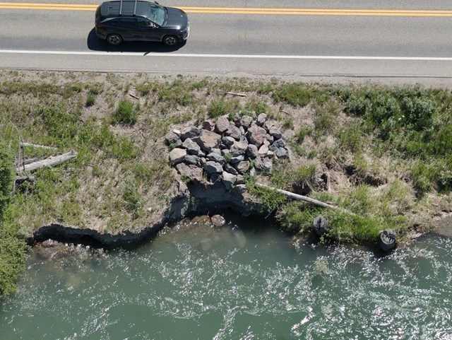 Car travels highway near future worksite