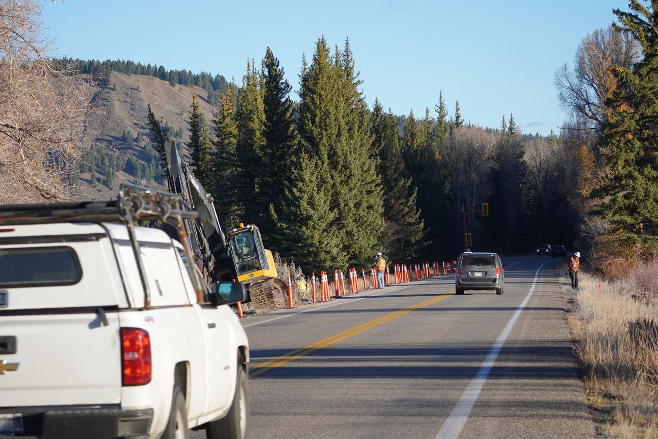 Vehicles transit through construction zone
