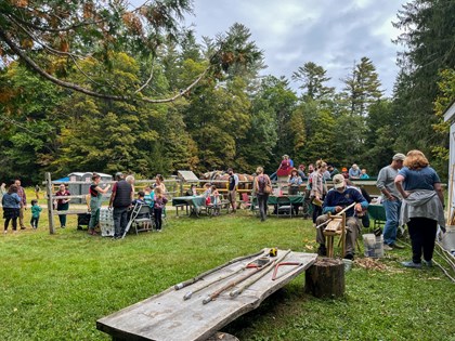 Visitors explore kids activities at a Junior Ranger station with 4 stations