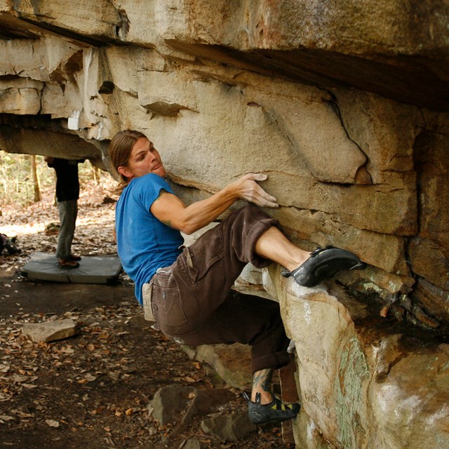 A rock climber bouldering.