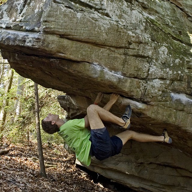 A rock climber bouldering. 
