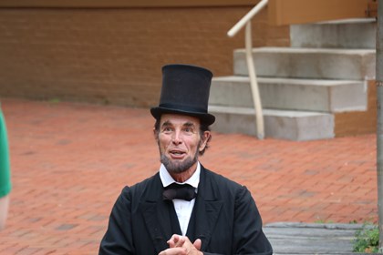 Abraham Lincoln Smiling in front of the Lincoln Home