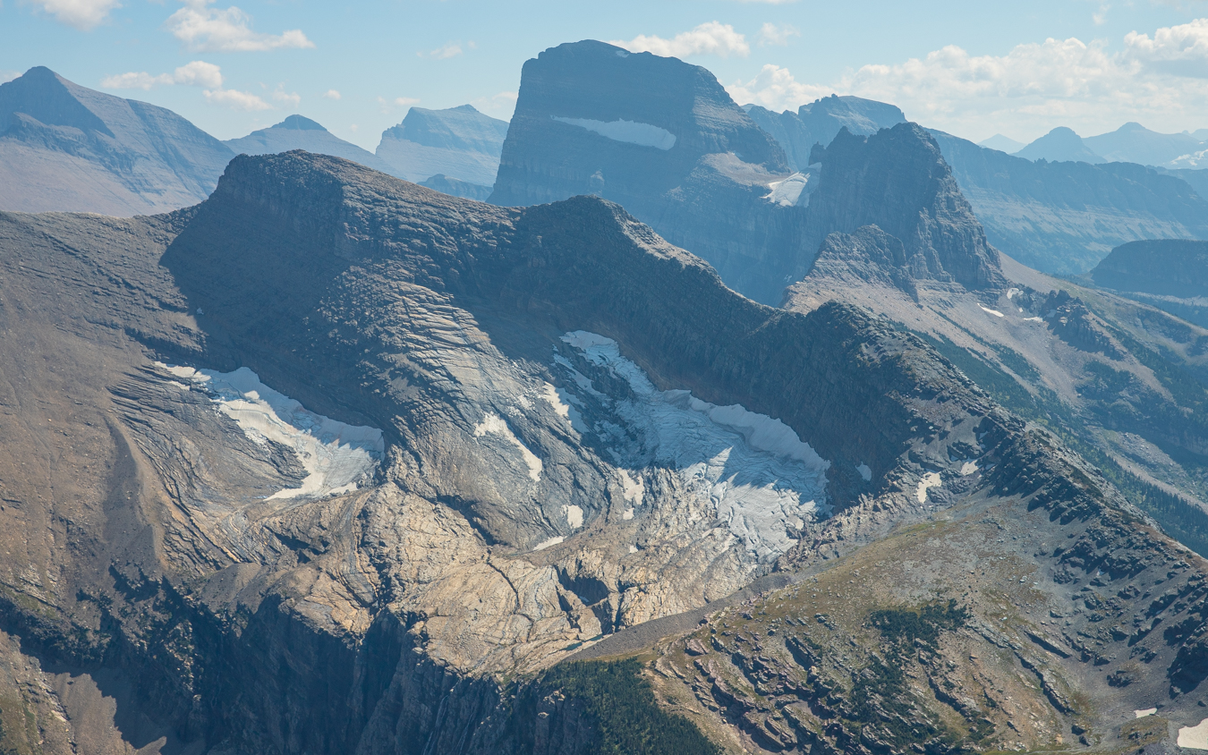Landscape of an alpine glacier with mountains behind.