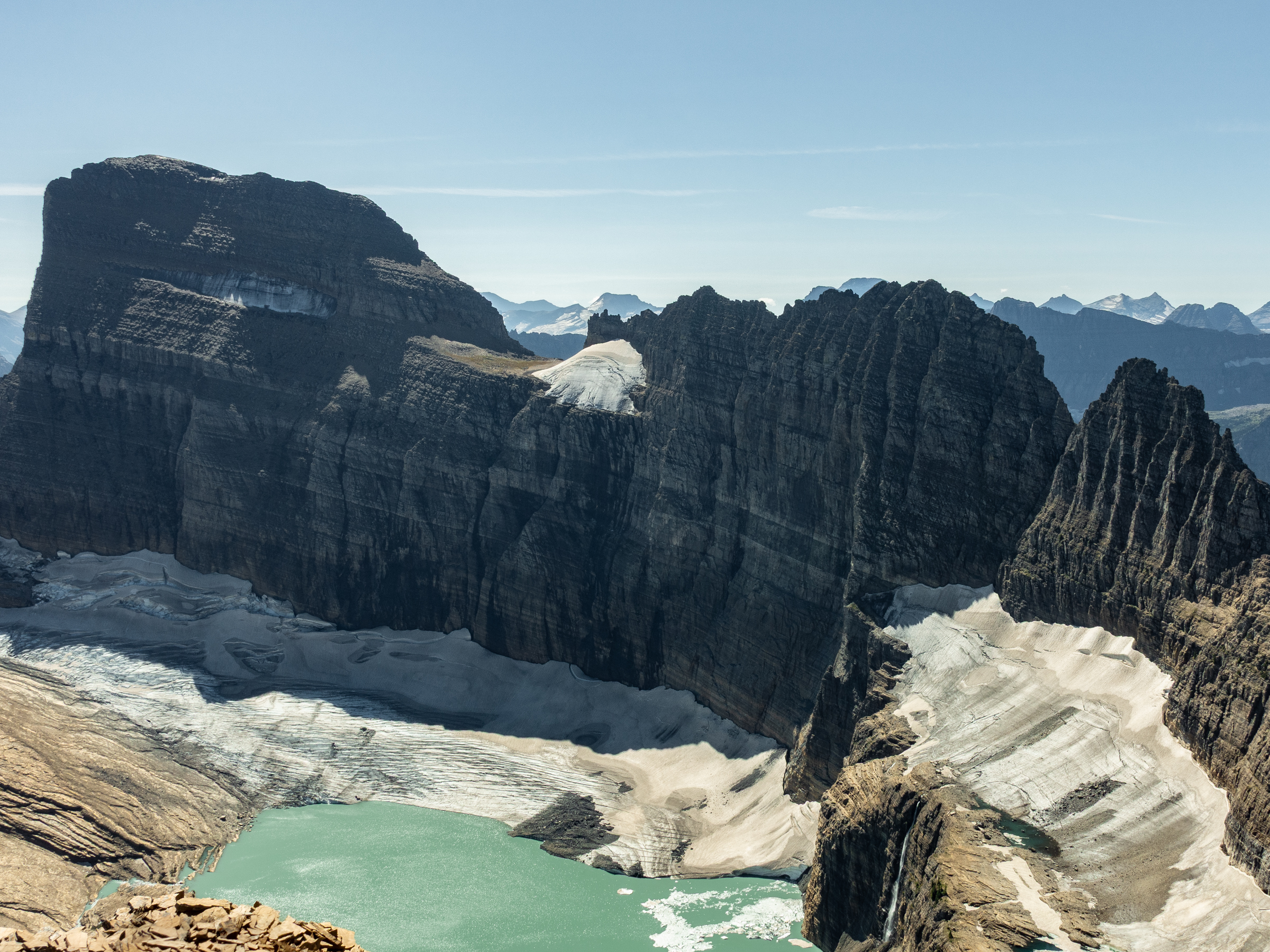 Landscape of an alpine glacier with mountains behind.