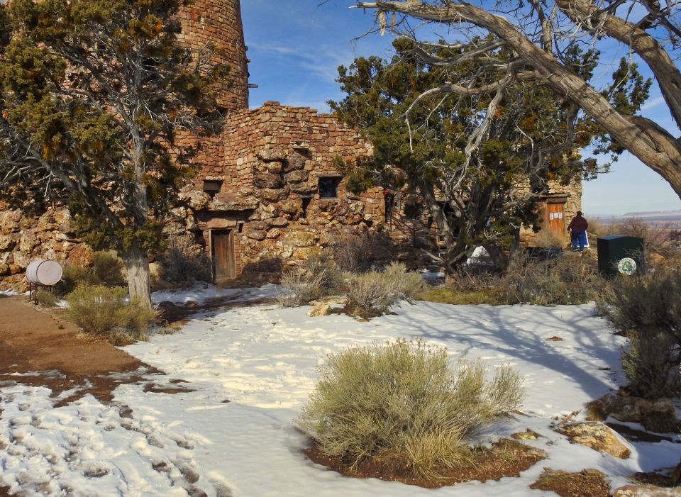 Construction site with wheelbarrow and steel frame for tower
