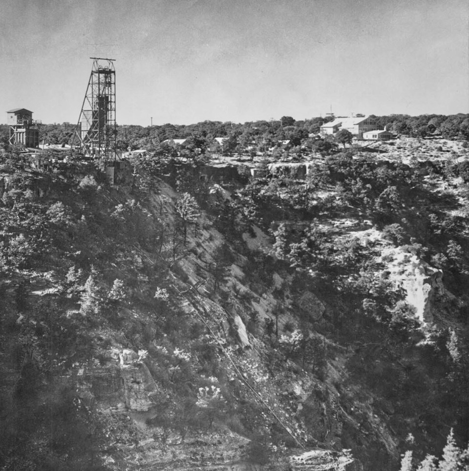 Rocky hillside with mining shaft tower on cliff edge