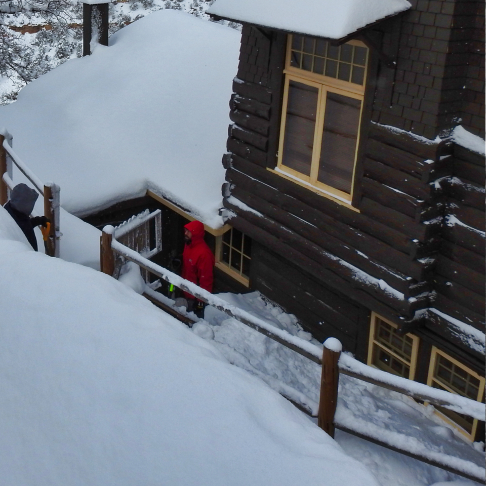 Trail and man next to wooden building