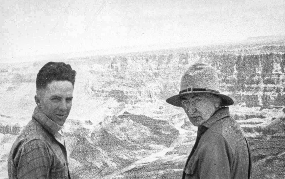 A man and woman with canyon in background
