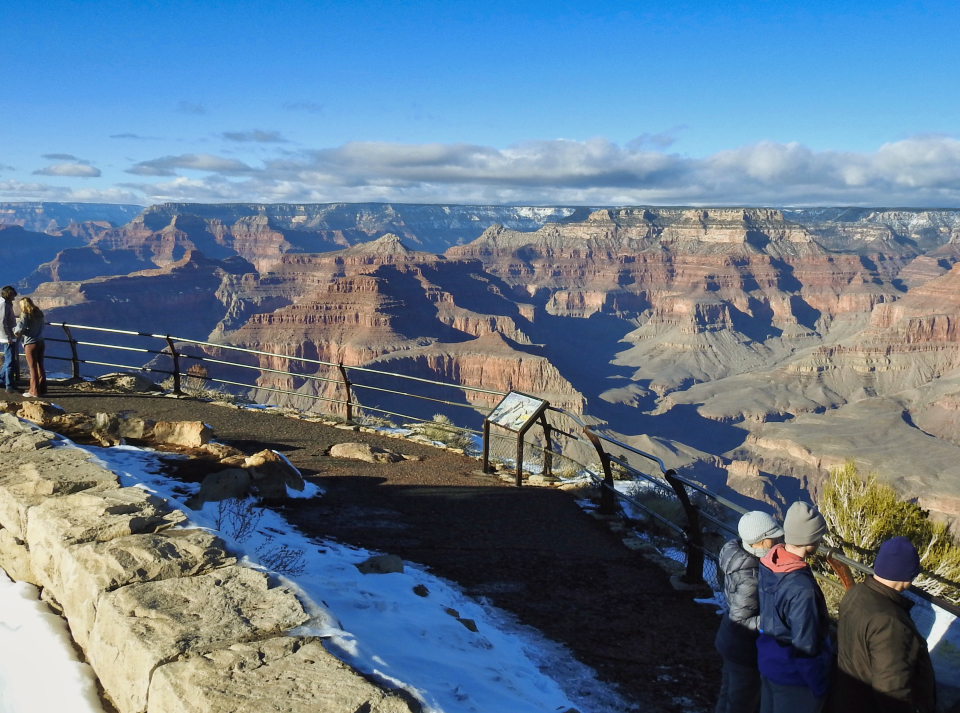 Group of soldiers line railing on edge of canyon