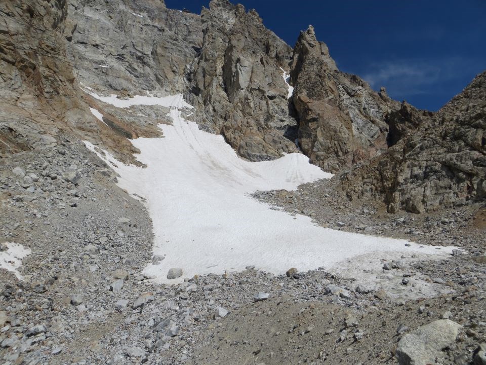 snow field over rocks