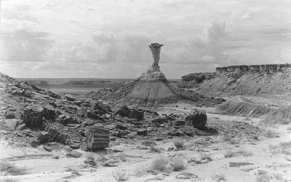 Mesas and grassland with a monument in the middle