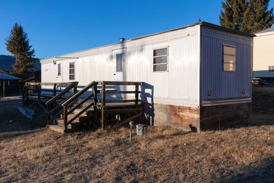 an old, run-down trailer home