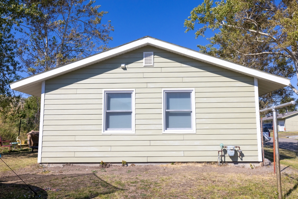 the side of a house that has weathered siding