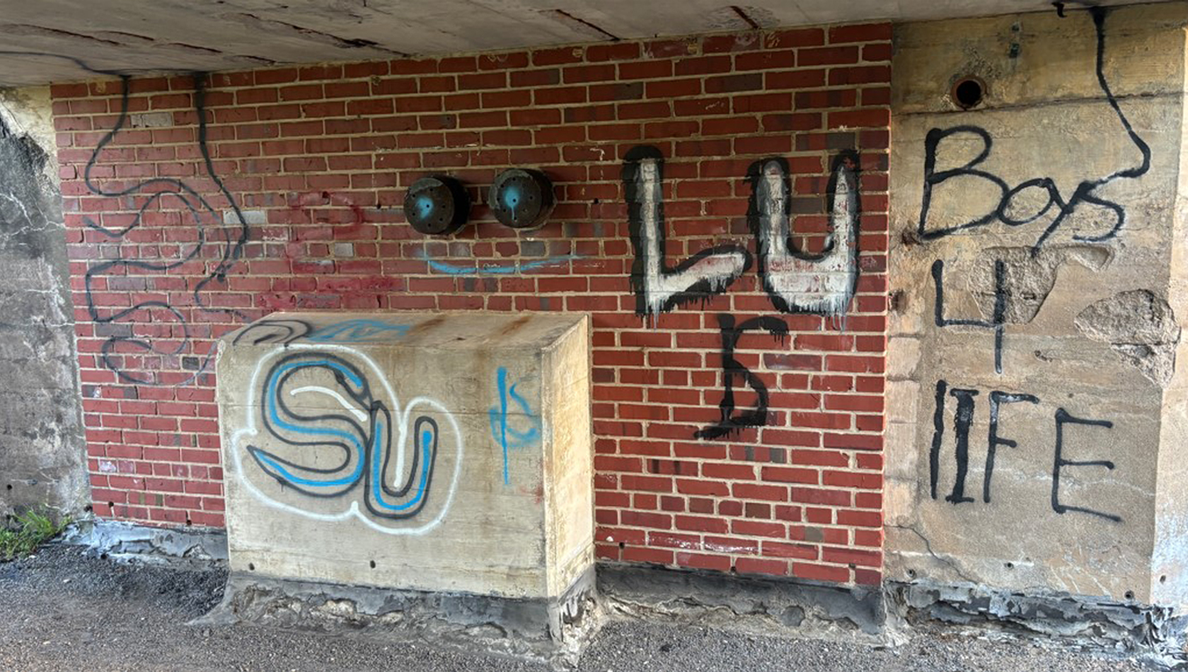 A wall covered in graffiti