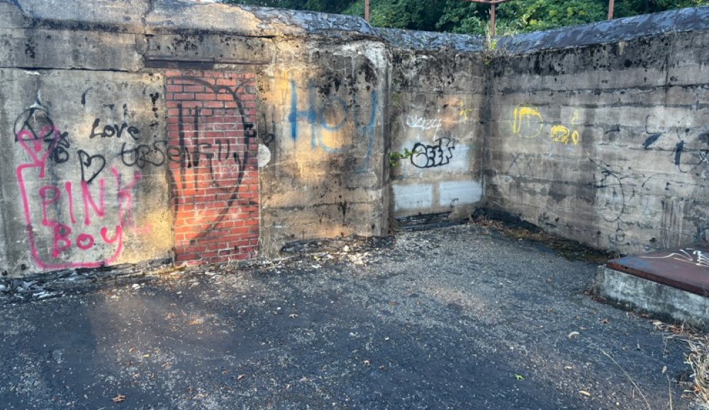 A concrete battery covered in graffiti