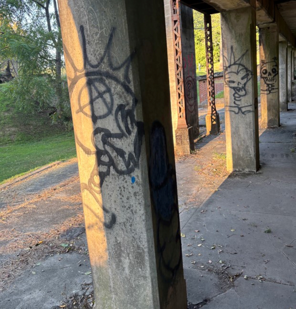 A pillar covered in graffiti