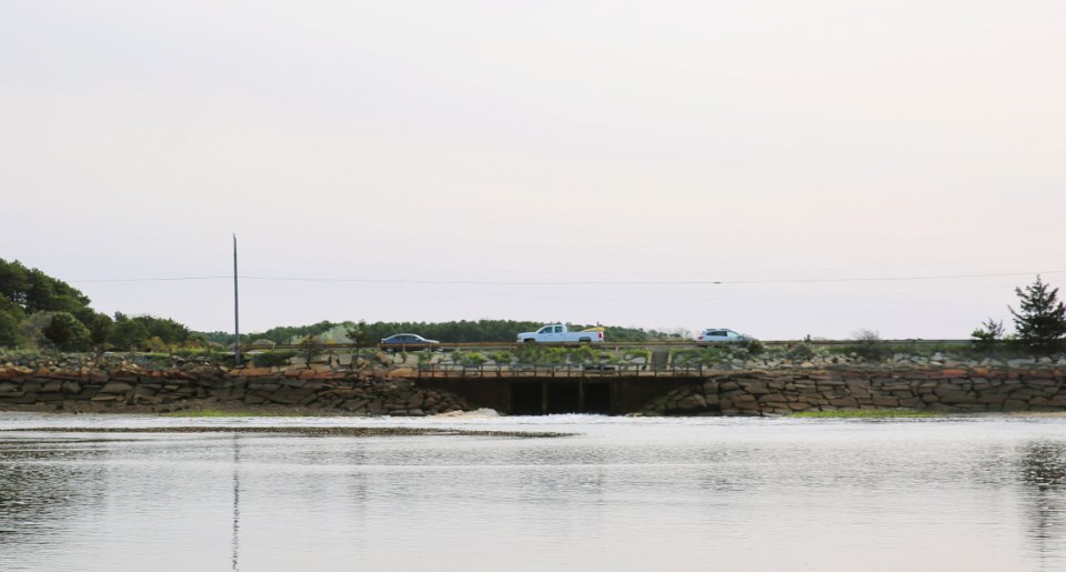 A dike crosses over a river.