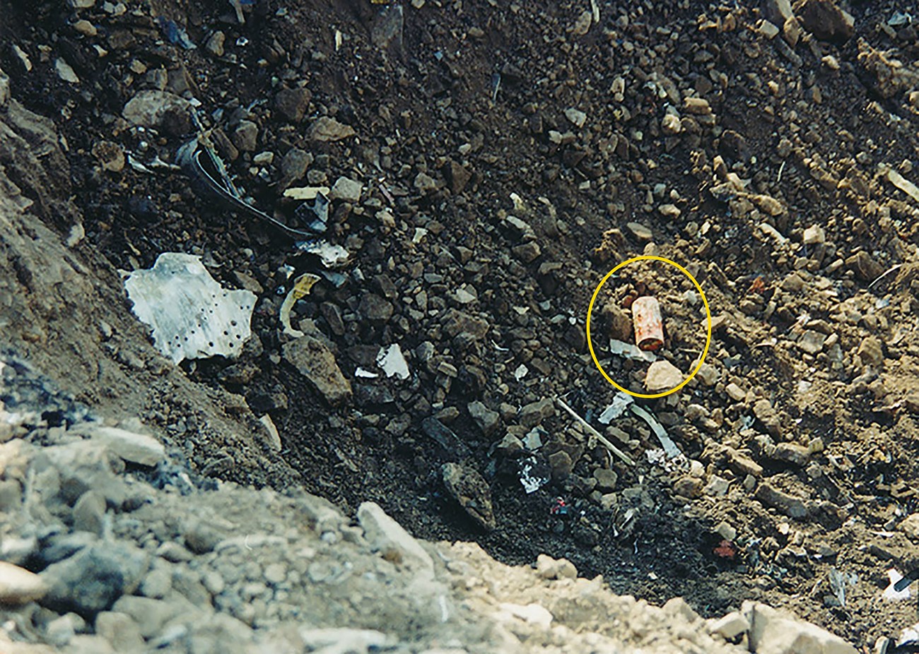 Debris, including the Flight Data Recorder is scattered near the crash site of Flight 93