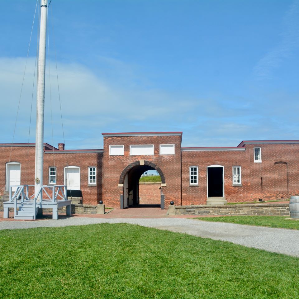 Presumably during a celebration of sorts, soldiers surround and sit/stand on top of the Sallyport, Fort McHenry’s entrance and exit onto the parade ground where the flag mast stands.