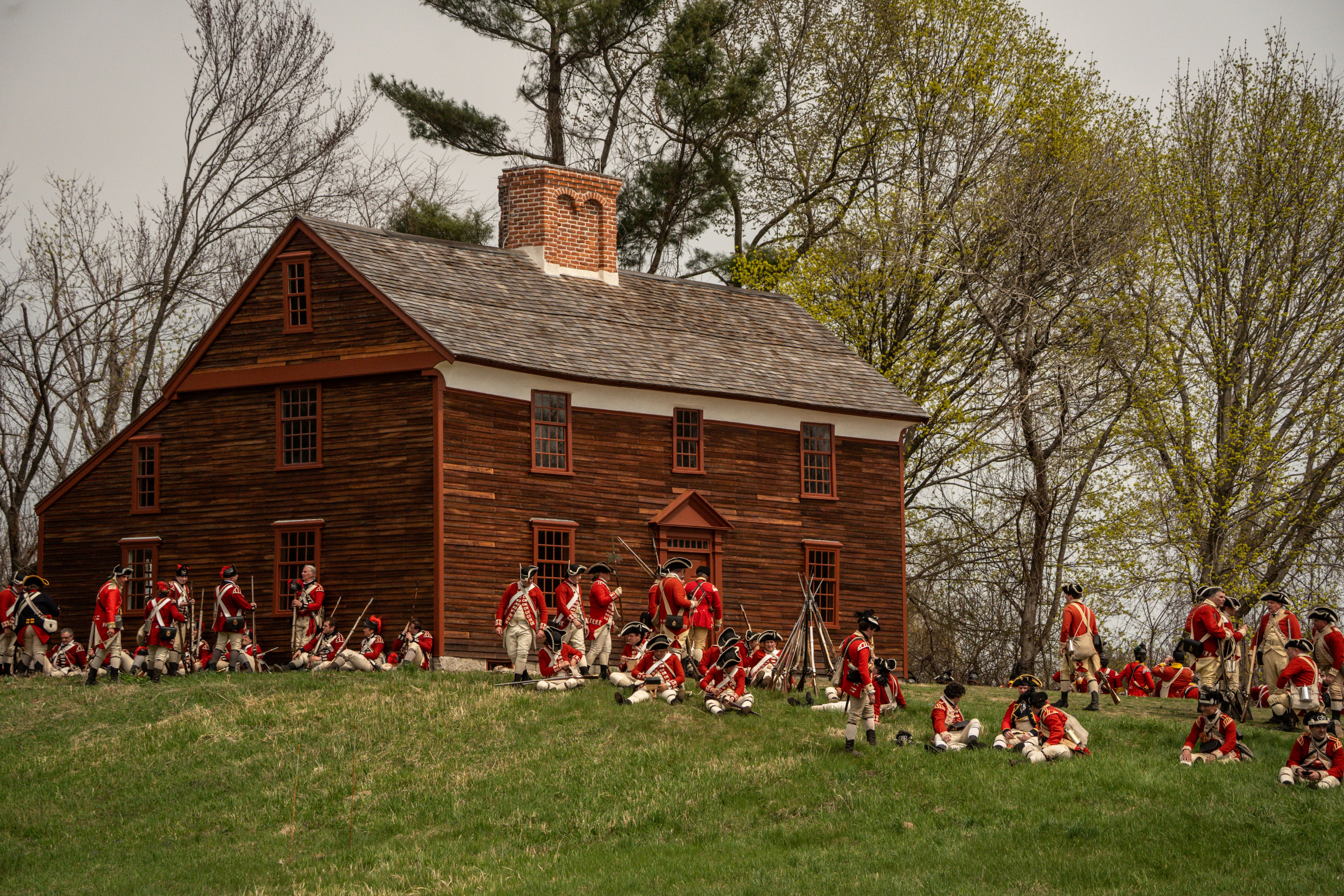 1775 Militia soldiers marching down a dirt road. The soldiers look tired and hot.