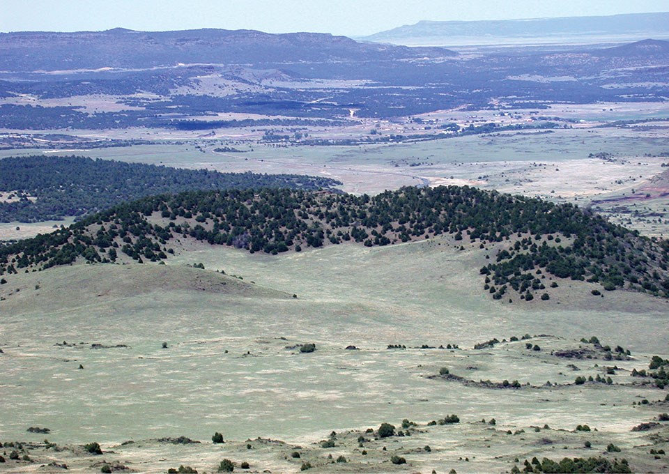 valley with low ring shaped hill