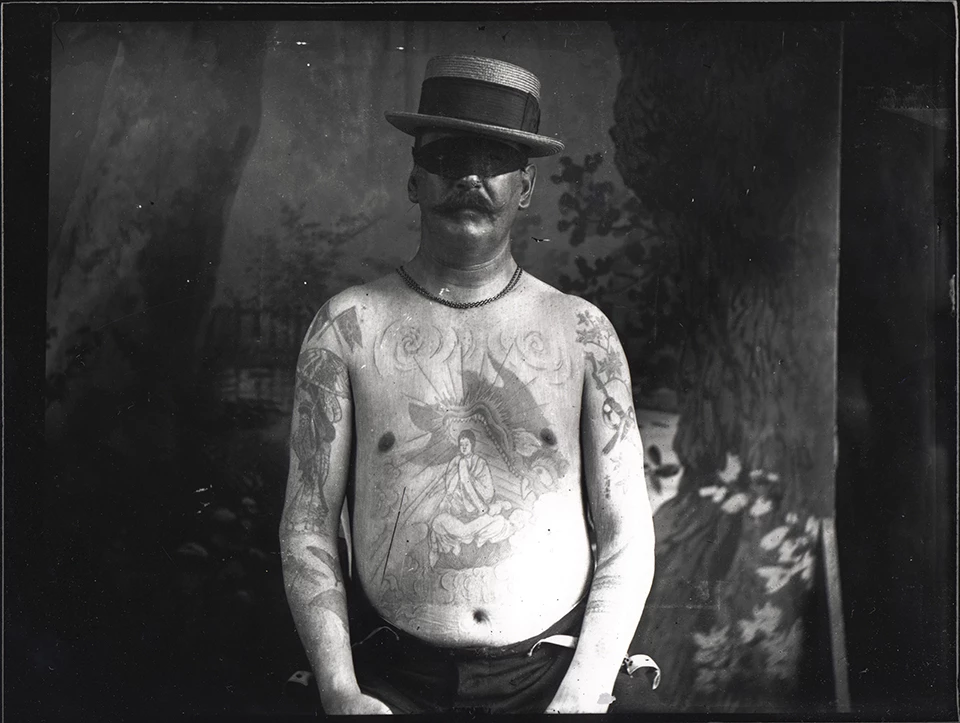 Glass negative showing a man in a hat