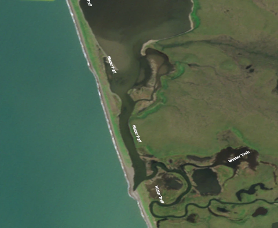 Satellite image of a lagoon in June with sea ice on the ocean