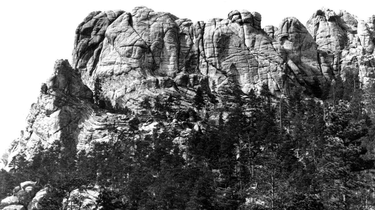 Black and white photo of Mount Rushmore as it appeared before carving began.