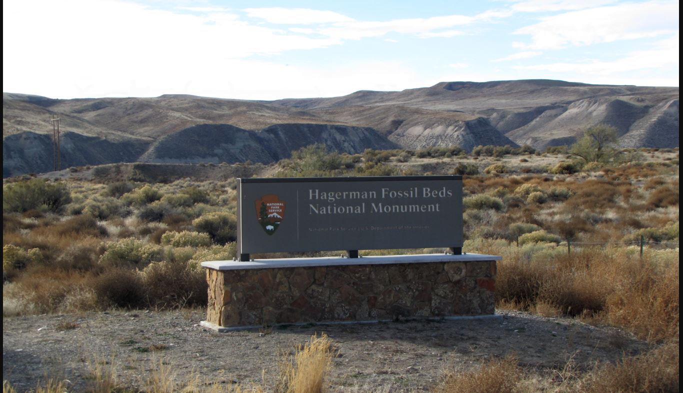 A view of the park entrance sign and the monument behind it. A view of the park entrance sign and the monument behind it.