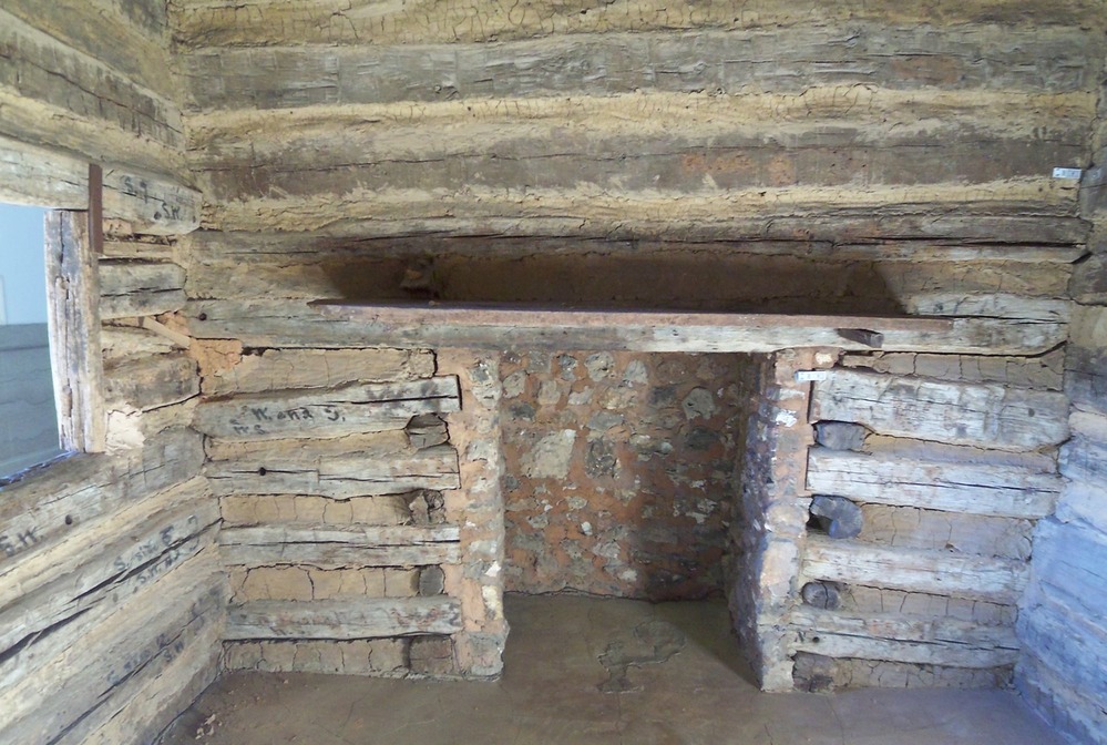 inside of log cabin, fireplace