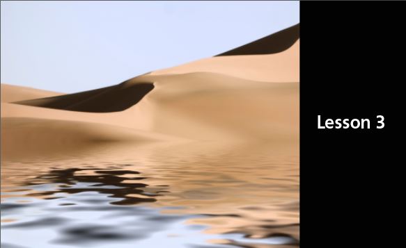windswept sand dunes behind a water-like foreground