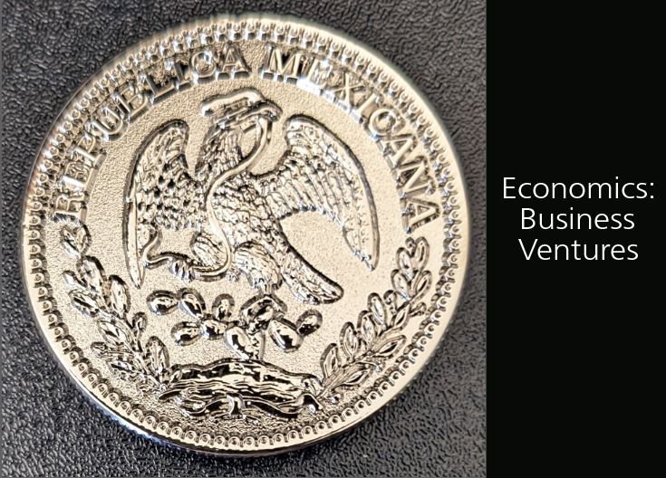 Close up photo of Mexican real silver coin showing eagle perched on cactus with snake in its mouth
