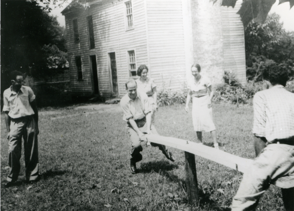 Image of Hyde Park's main house. The structure is a mix of Greek Revival and Federal style architecture. The earliest part of the house is brick, with white wood-paneled additions visible in the picture.