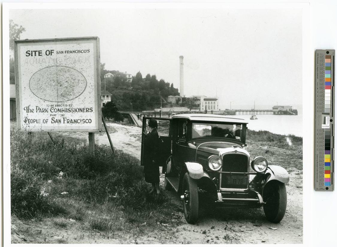 black and white photo next to a color chart. The photo features a scene of waterfront construction. black and white photo next to a color chart. The photo features a scene of waterfront construction.