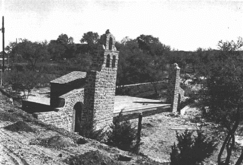 black and white photo of stone stuctures outside