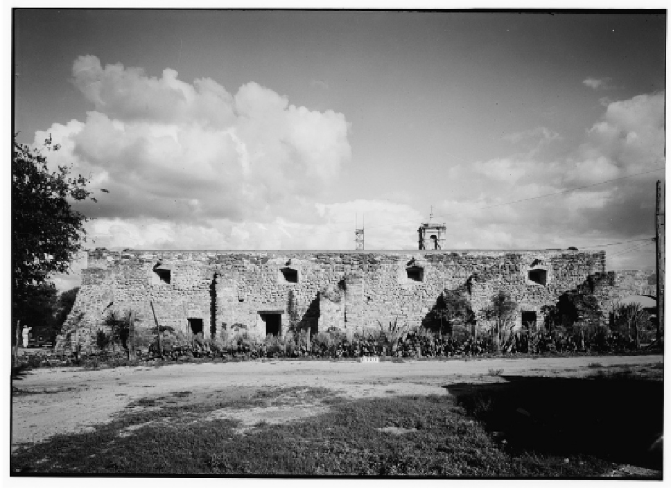 black and white old image of a stone granary with buttresses