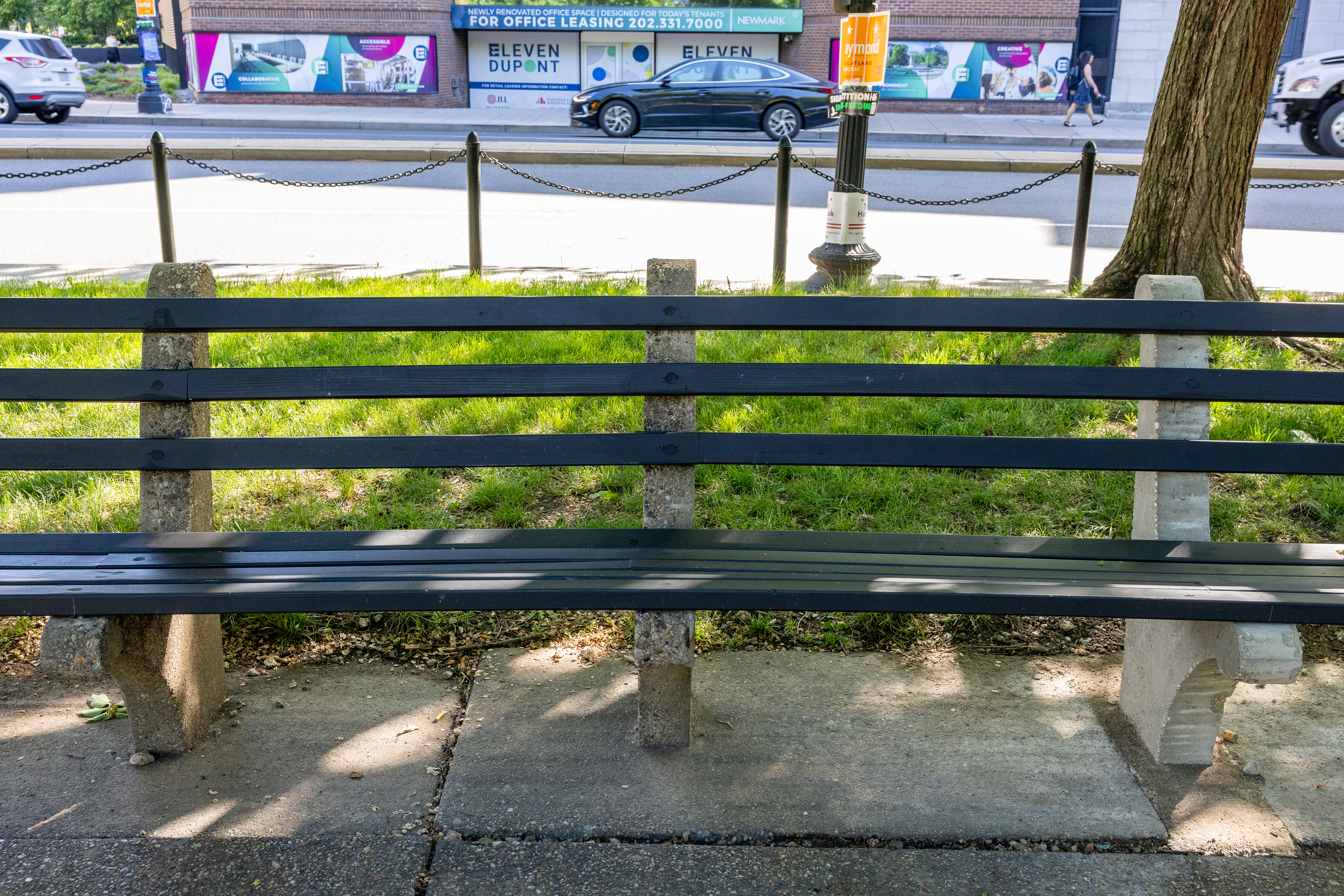 Benches in disrepair at a park in a city