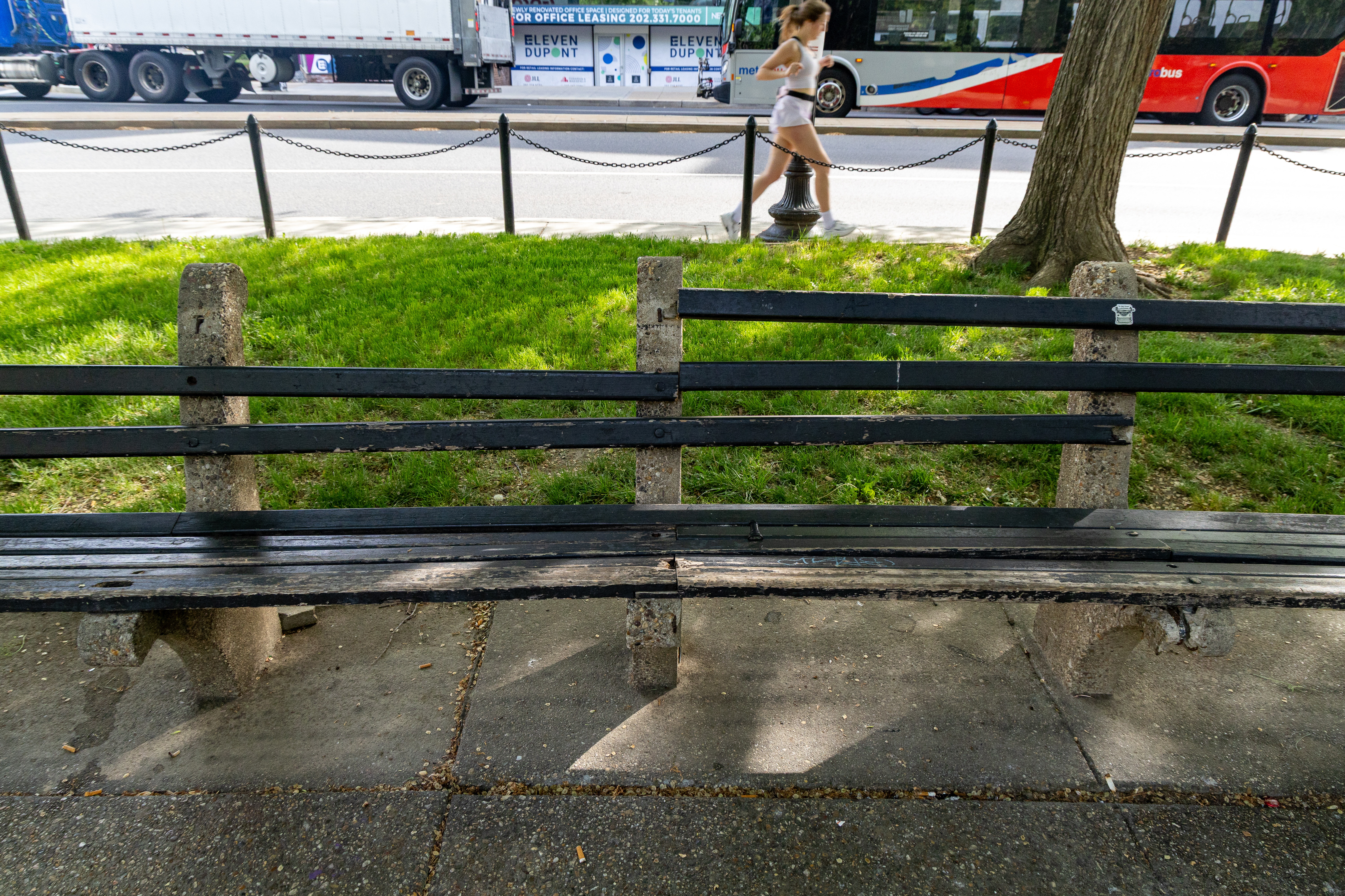 Benches in disrepair at a park in a city