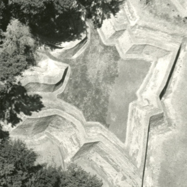 an aerial photo of a star-shaped earthen fort