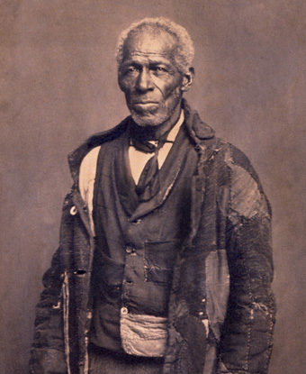 Photograph of George Roberts, wearing tattered cloak Photograph of George Roberts, wearing tattered cloak