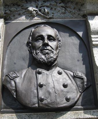 Photograph of a sculpture of Sherrill on a monument