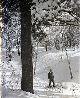 Dorr snowshoeing through a winter wonderland in Acadia.