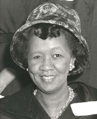 B&W photo of Ms. Height wearing a hat and black suit