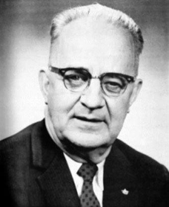 B&W portrait of Bull Connor in black suit and glasses
