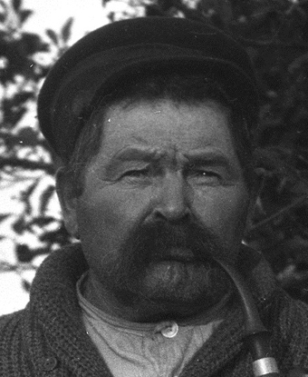 Image of Ephraim Meekins with smoking pipe, 1920s