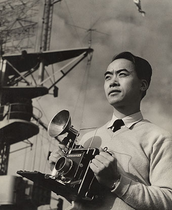 Photograph of man holding camera