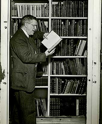 Harry Dana reading a book in the Study vault of the Longfellow House